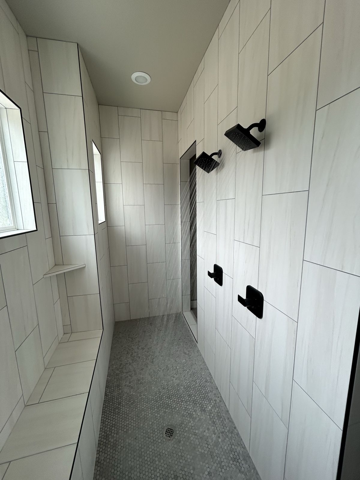 Luxury multi-head tile shower installed by Blue Diamond Plumbing