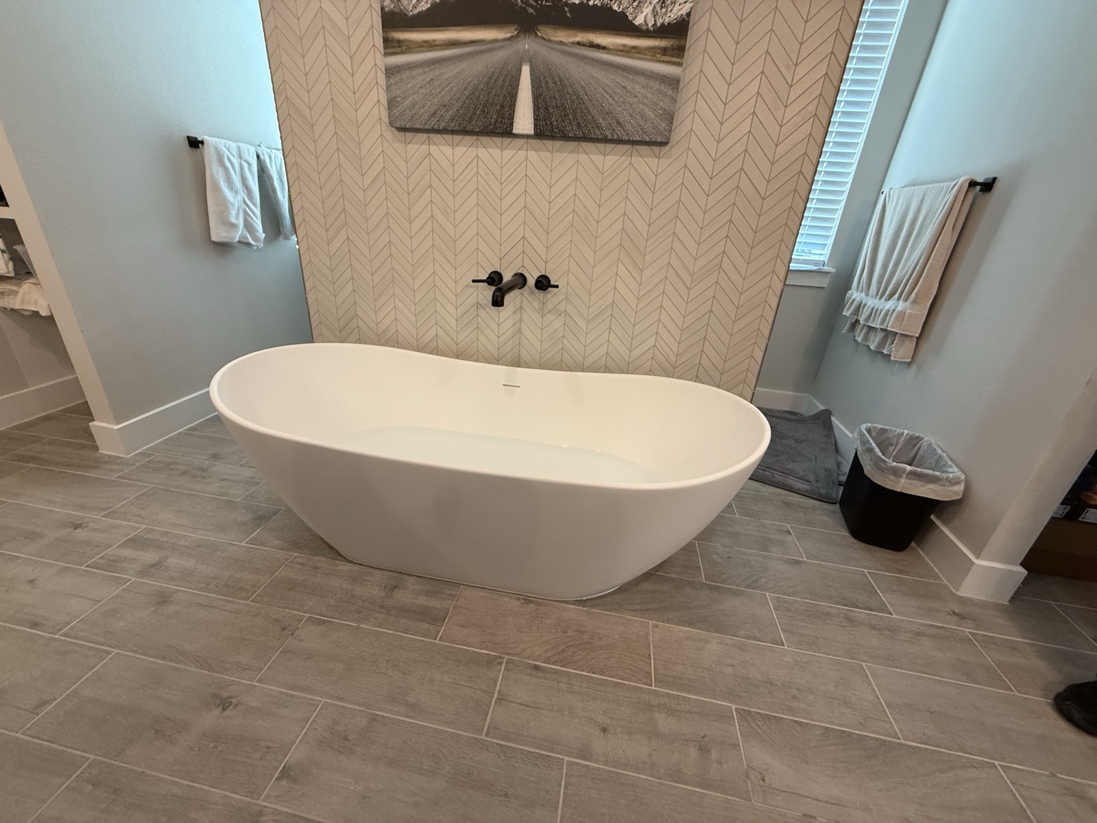 Custom freestanding tub and tile work completed by Blue Diamond Plumbing