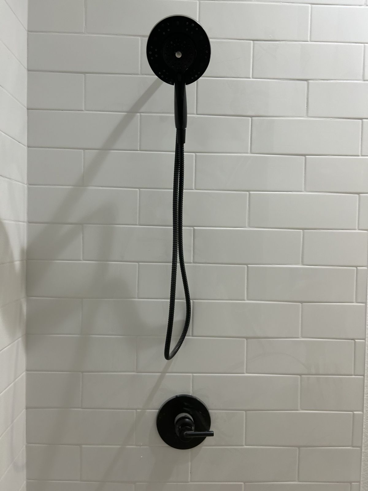 Matte black shower fixture installed leak-free by Blue Diamond Plumbing